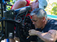 Bike mechanic working on a bicycle during a bike repair event in Gresham