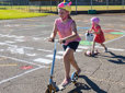 Children riding scooters on traffic playground in Gresham