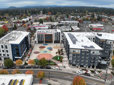 An aerial photo showing the complete three building Downtown Rockwood development with plaza and splash pad.